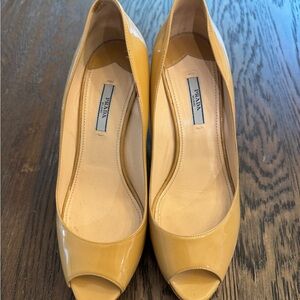 Prada Patent leather Beige Peep-Toe Wedges with cork platform heel.